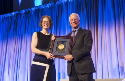Jim Millstein poses with Dean Gillian Lester and his 2020 Medal for Excellence Award.
