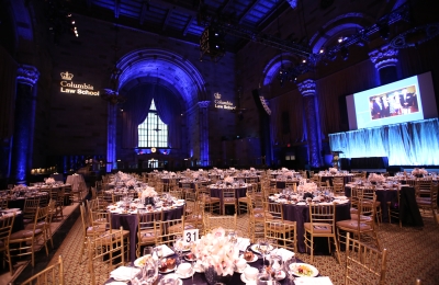 View of the Winter Luncheon reception space, wth tables and floral centerpieces