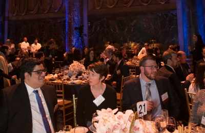 Three people seated at a table