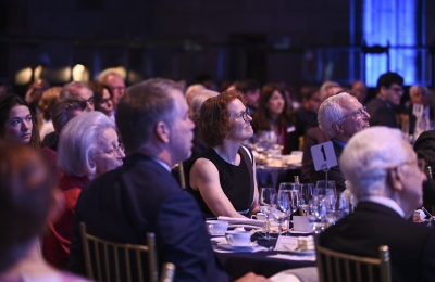 People seated at a table at Winter Luncheon