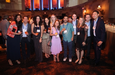 A dozen alumni at reunion reception 