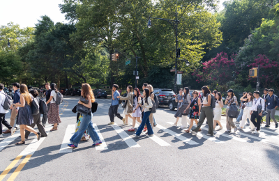 LLM Orientation 2025 students walking down street