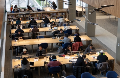 Looking down at students sitting at long tables