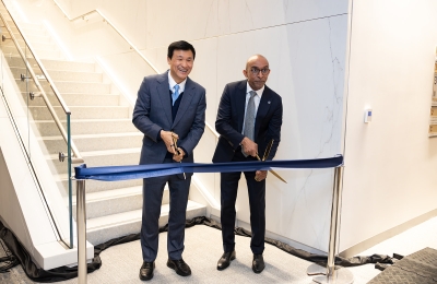 Cutting ribbon Dec 4 at library opening