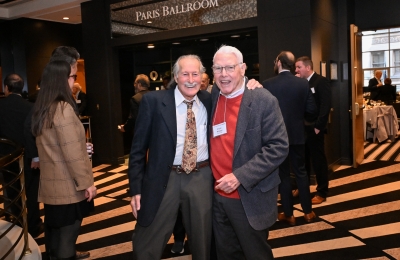 Two men with arms around each other at Stone Circle Luncheon