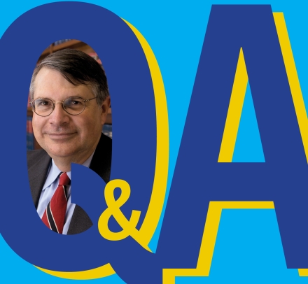 Graphic Q and A with man's head shot inside the Q