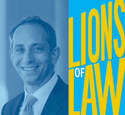 Blue-scale photo of man in suit with "Lions of Law" graphic 