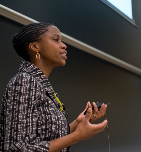 Professor and Dean Olatunde Johnson teaching in front of a blackboard