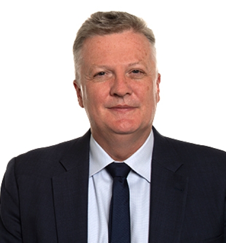 Bank of England's Huw Pill, in dark suit jacket and tie and a white dress shirt.