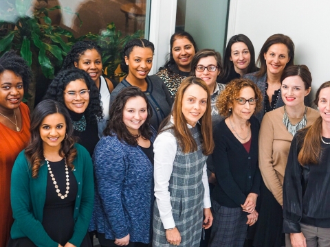 Photos of the SJI Staff in a group smiling 
