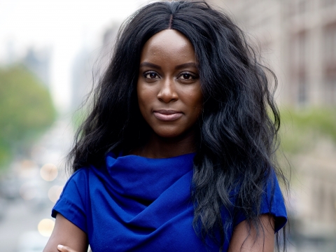Columbia Law Review Editor in Chief Oluwatumise Asebiomo in blue dress