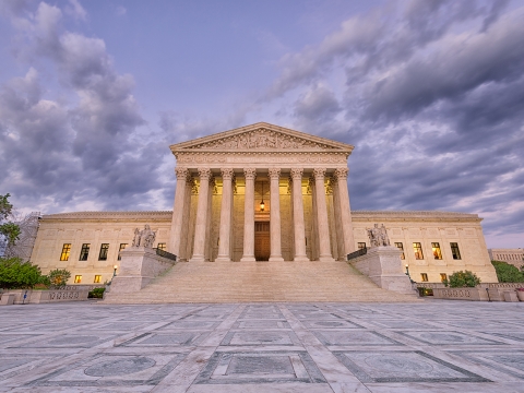 Photo of the U.S. Supreme Court Building at dusk