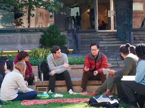 Professor Bert Huang meets with students on Revson Plaza