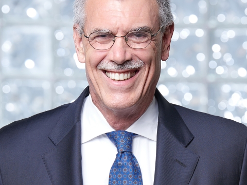 Former U.S Solicitor General Donald Verrilli Jr. in blue suit with a white shirt and blue tie/