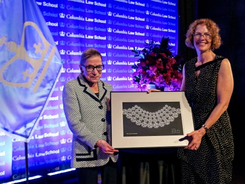 Dean Gillian Lester presents Ruth Bader Ginsburg with a custom made lace collar.