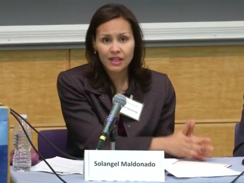 Solangel Maldonado speaks into a microphone.