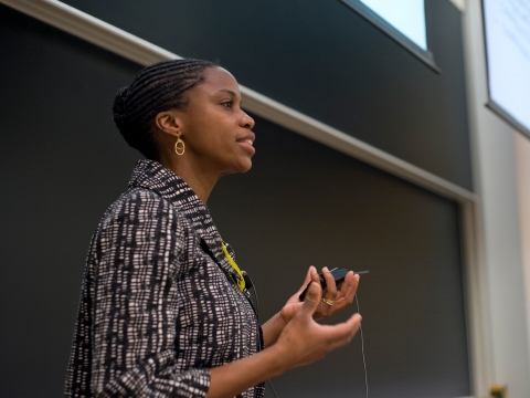 Professor and Dean Olatunde Johnson teaching in front of a blackboard