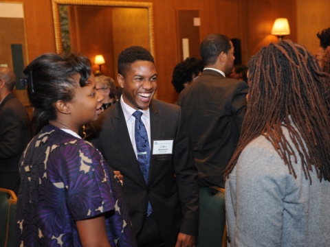 Attendees socialize at the 2016 Alumni of Color reception