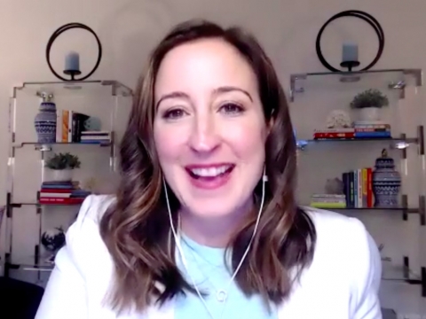 Alexandra Carter '03 in front of two bookshelves in the Virtual Speaker Series