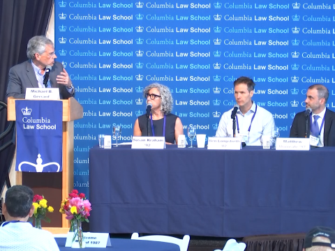 Four people in front of a Columbia Law School backdrop