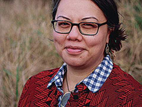 Dark haired woman in red cardigan 