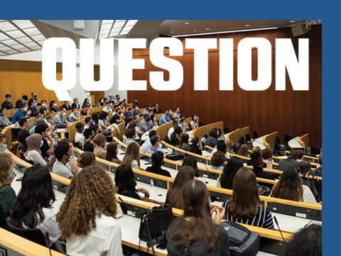 The word QUESTION superimposed over students sitting in a lecture hall