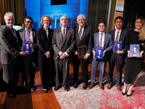 A group of people holding books