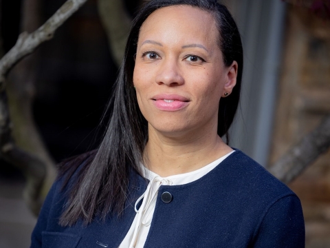 Woman in a blue jacket and white shirt