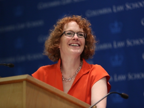 Woman at podium