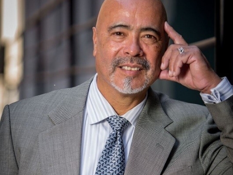 Juan Cartagena in suit and tie