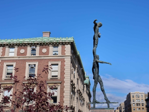 Tightrope Walker statue on Revson Plaza