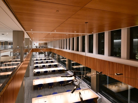 overhead photo of a large room with windows and long tables
