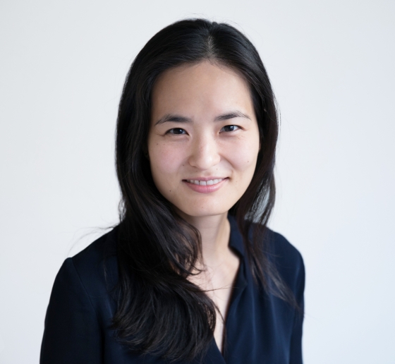 Portrait of Sarah Seo in black against a white background. 