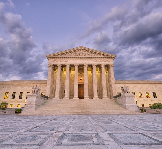 Photo of the U.S. Supreme Court Building at dusk