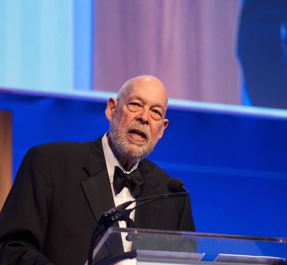 Michael J. Graetz speaking at a podium