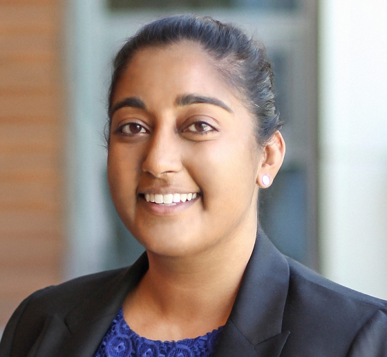 Woman in a blue blouse and black blazer