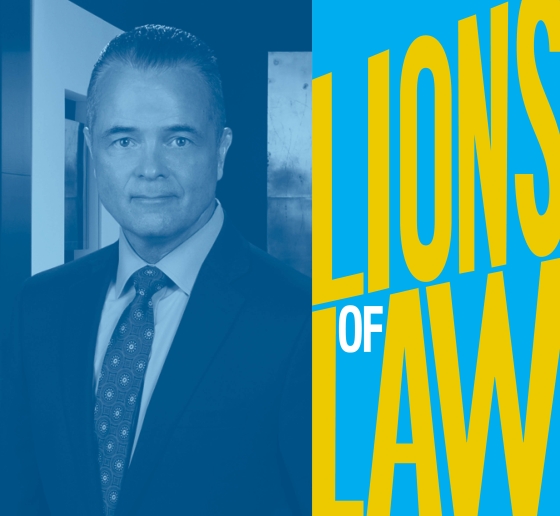 Man in tie and Lions of Law logo