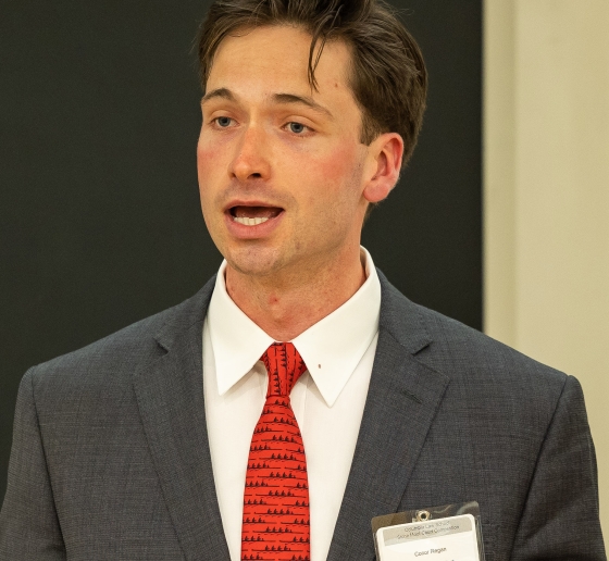 Conor Regan speaking at HFS Moot Court semi-finals