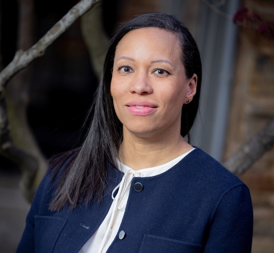 Woman in a blue jacket and white shirt