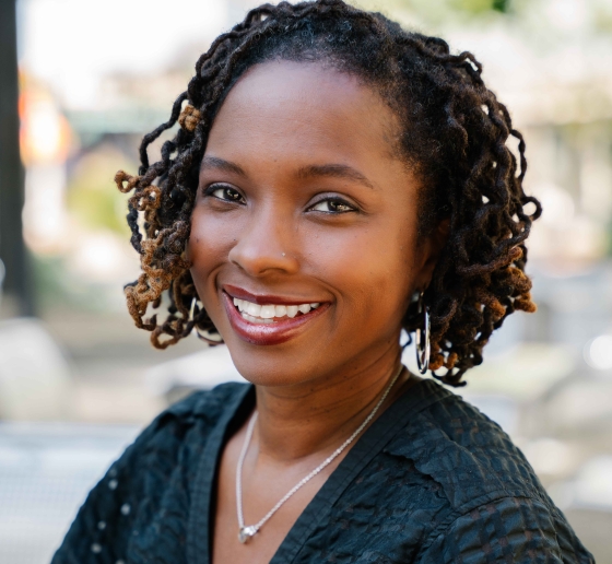 Headshot of Professor Nicole Smith Futrell outdoors and smiling 