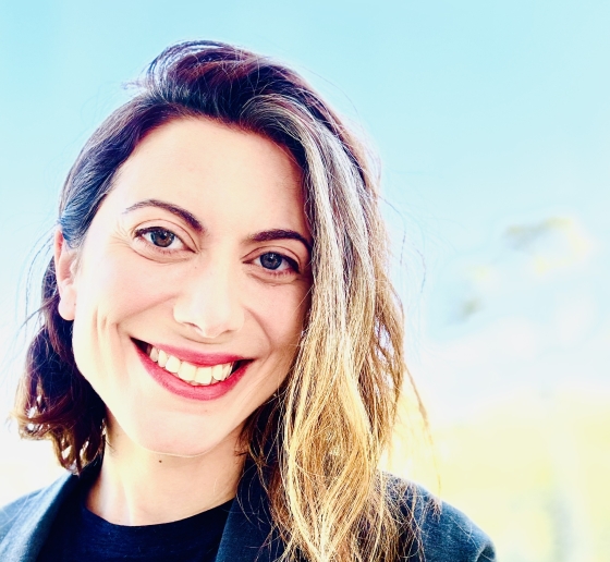 Erica Finkle headshot with pale blue background