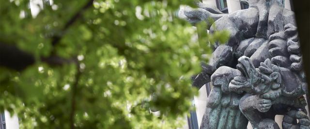 Pegasus statue with some green leaves