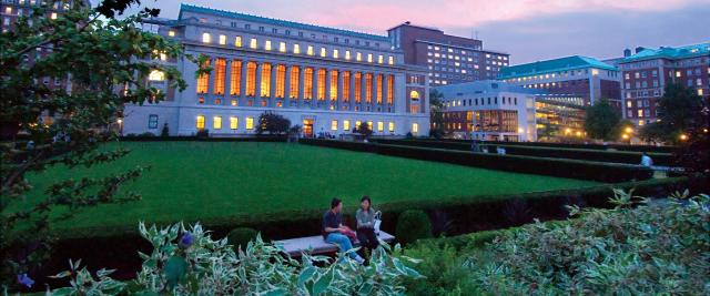 Butler library at dusk with a pink sunset