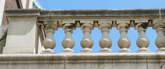 A row of small pillars supporting a railing on campus