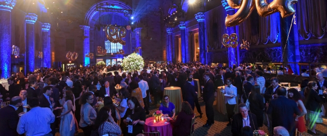 A balloon that says 1994 floats over attendees at Reunion 2019 at the New York Public Library.