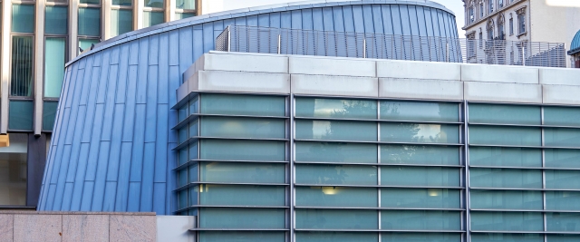 A view of Jerome Greene Hall, campus, add Drapkin Lounge as seen from Amsterdam Avenue overpass