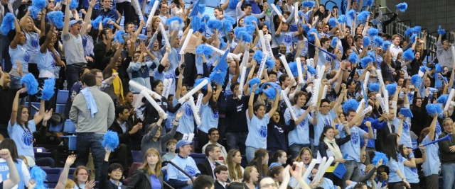 Spectators cheer at the Dean's Cup basketball game.