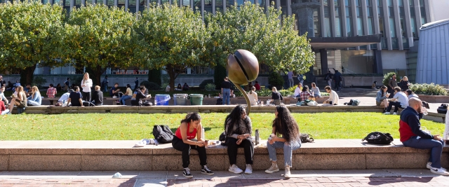 Law students socialize on Revson Plaza.