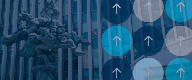A picture of the front of the law school overlayed with arrows inside of circles