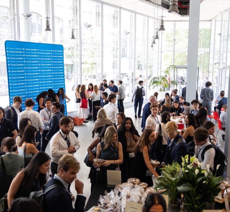 Crowd of students mingling over breakfast 